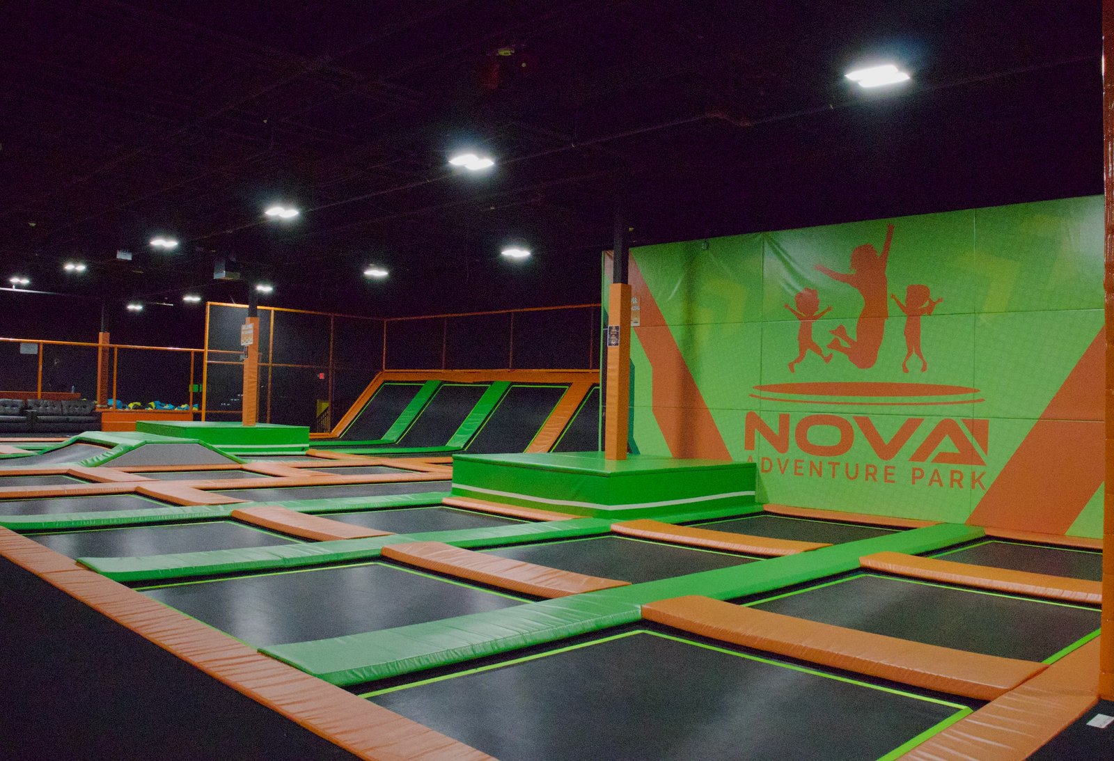 Main court trampoline area with rows of trampolines at Nova Adventure Park